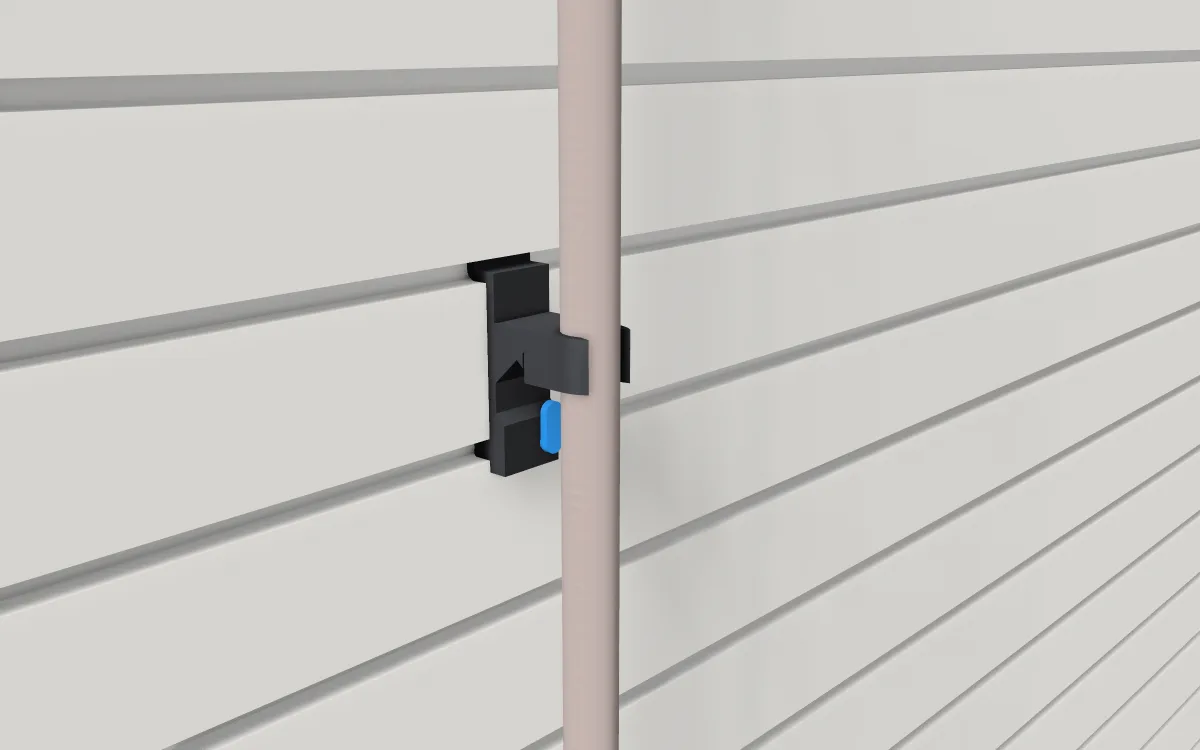 Broom & mop gripper on slatwall, holding a broom handle