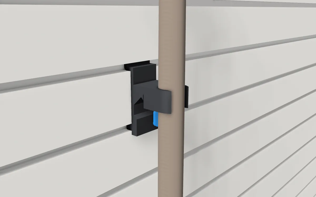 Rake & shovel gripper on slatwall, holding a spade by its handle