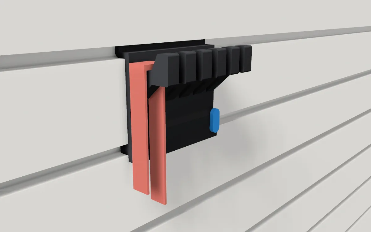 Six-prong hook on slatwall, holding two cables and a rag