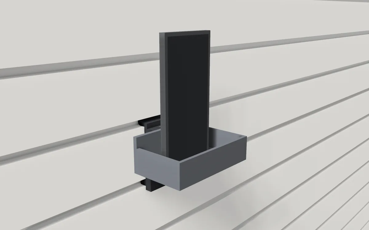 Small drop-in tray on slatwall, holding a phone